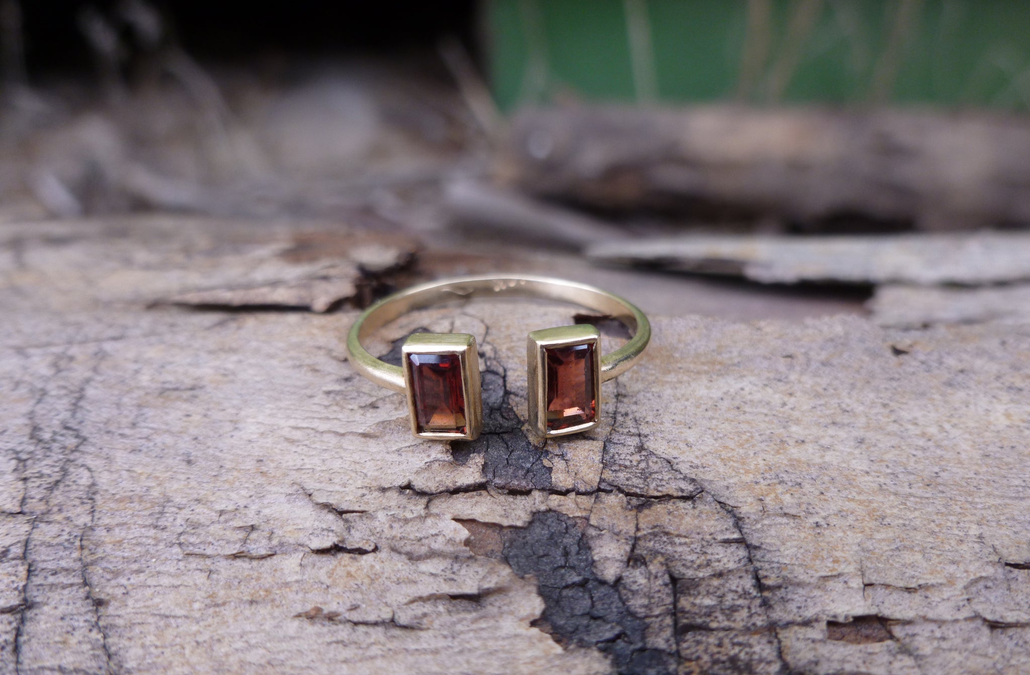 Open gold ring with two garnets - G Rubinstein Jewellery