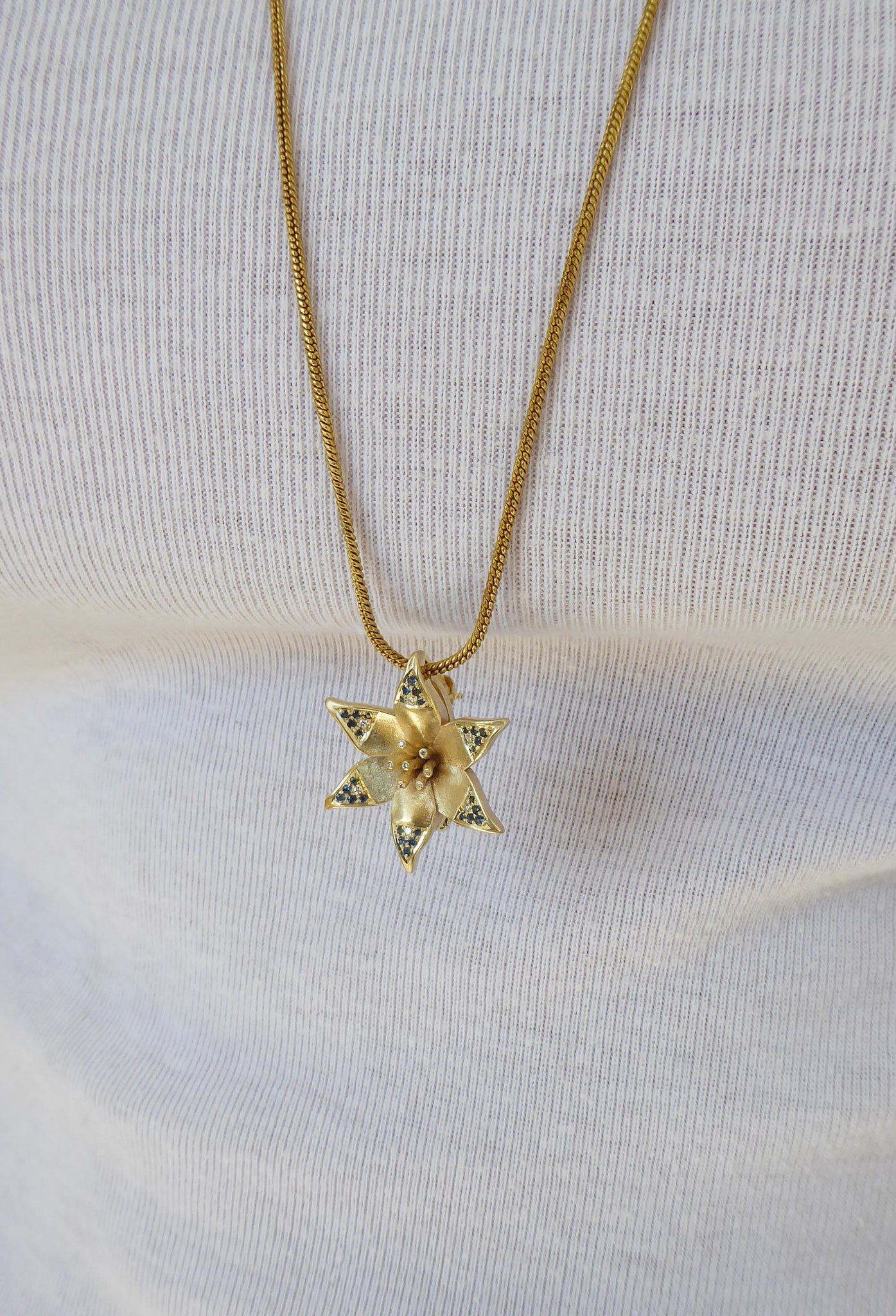 Star of David Lily pendant with diamonds and sapphires