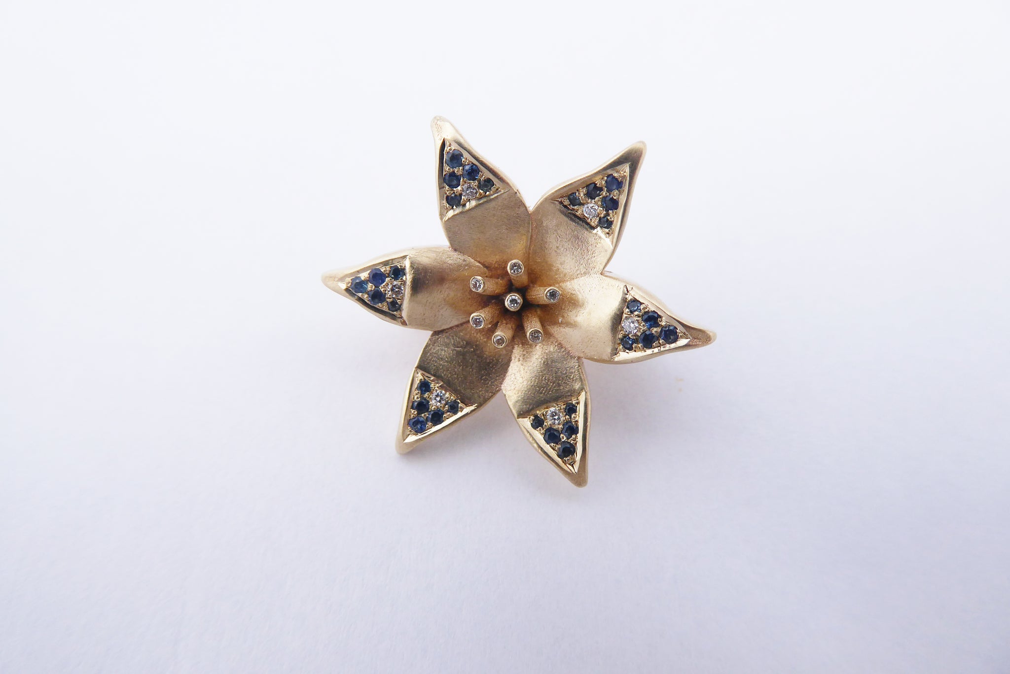 Star of David Lily pendant with diamonds and sapphires
