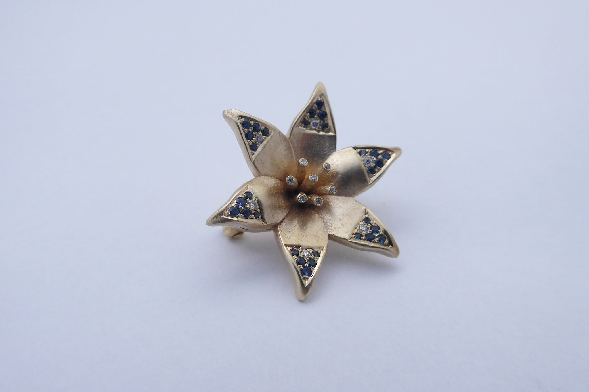 Star of David Lily pendant with diamonds and sapphires