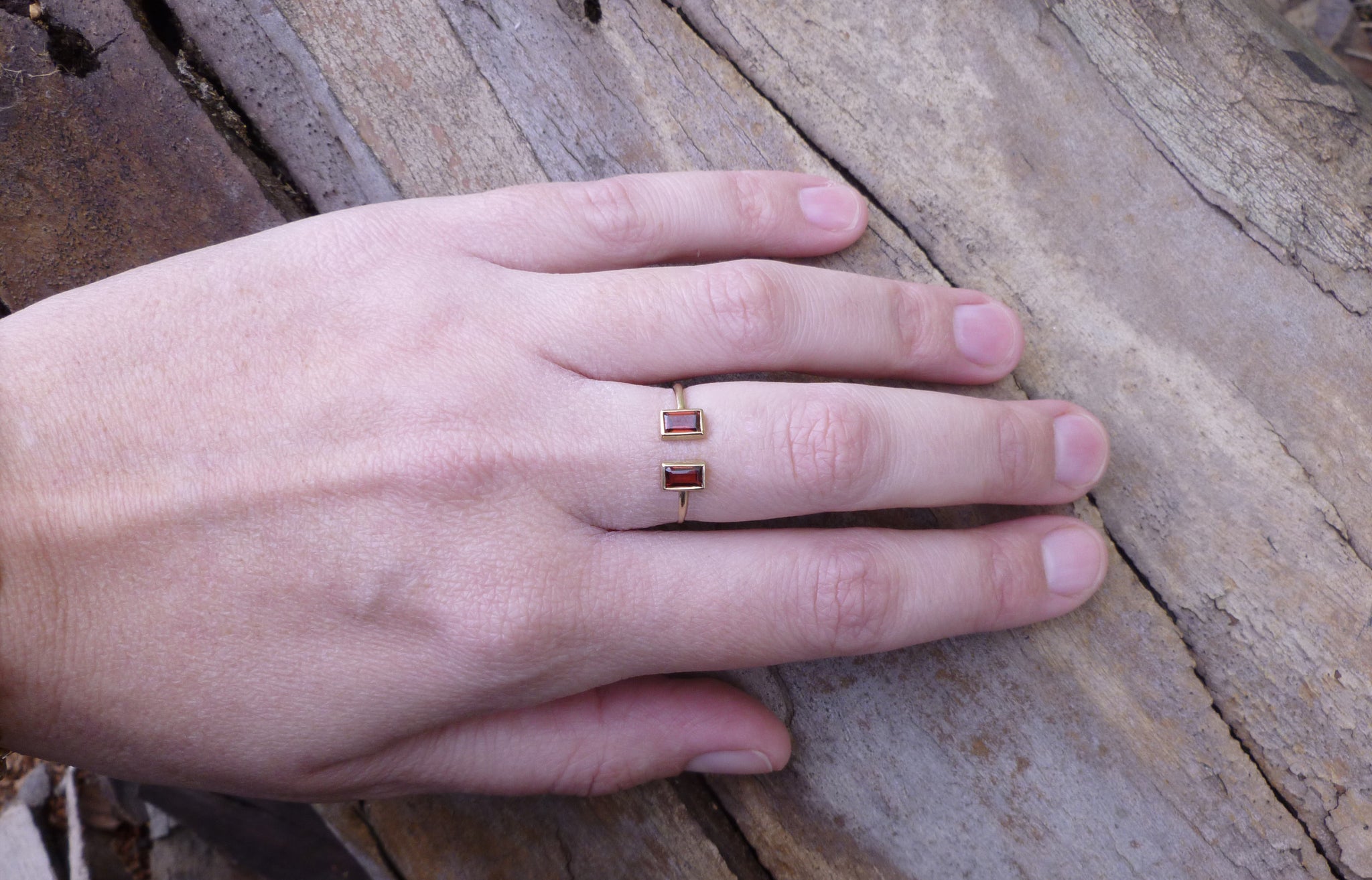 Open gold ring with two garnets - G Rubinstein Jewellery