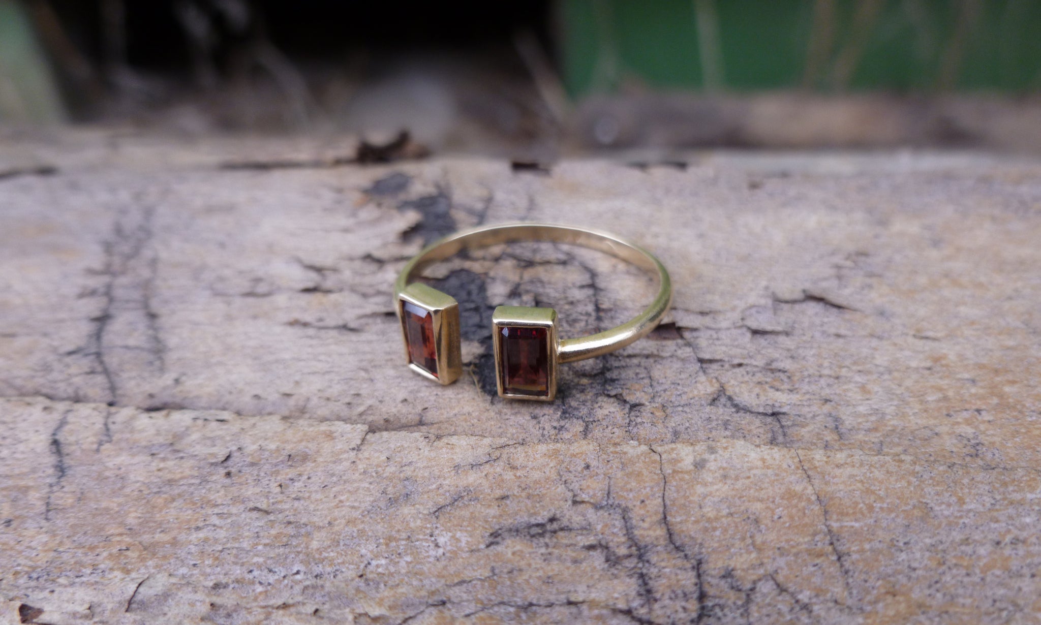 Open gold ring with two garnets - G Rubinstein Jewellery