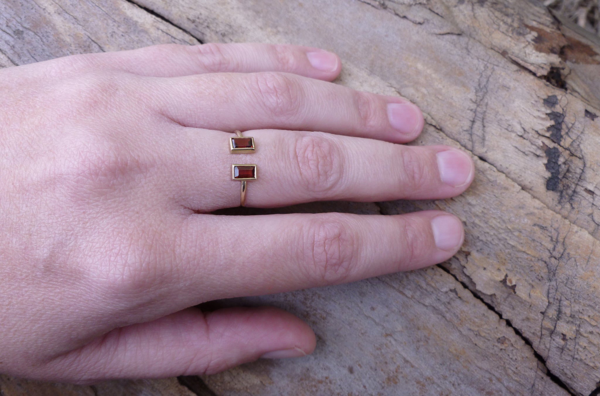 Open gold ring with two garnets - G Rubinstein Jewellery